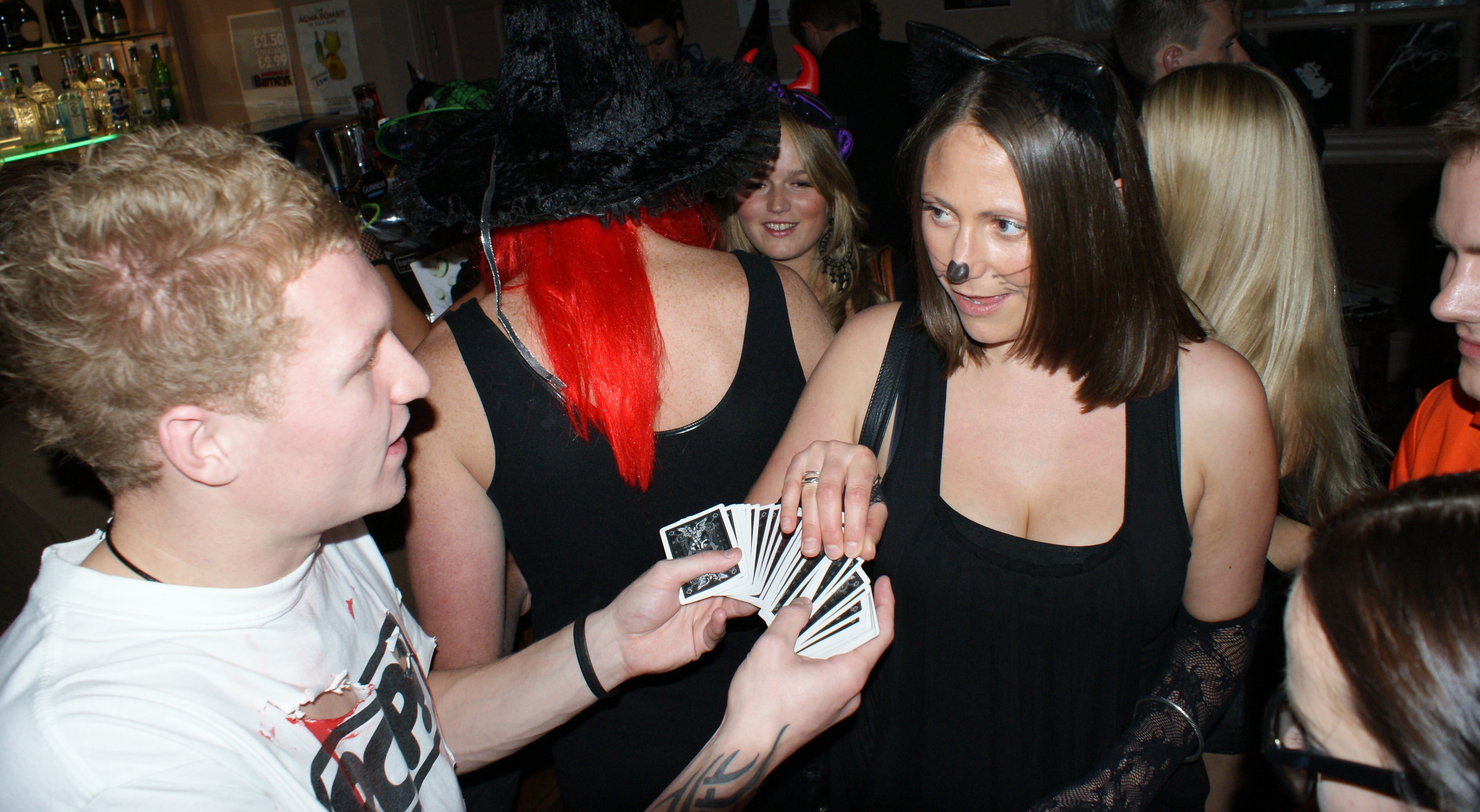 Street Magician Liam Walsh performing close up magic at Barnies Nightclub in Hove
